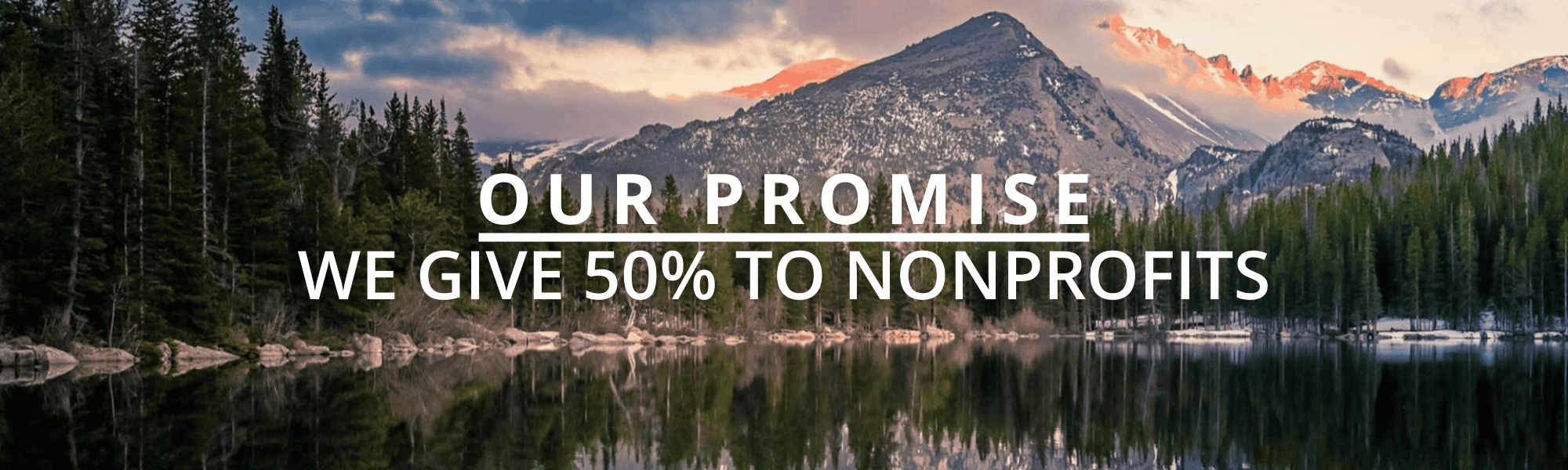 Colorado mountains and pine forest reflected in a still lake at sunrise, representing Good Steward Partnerships’ Colorado roots and commitment to clarity and transparency.
